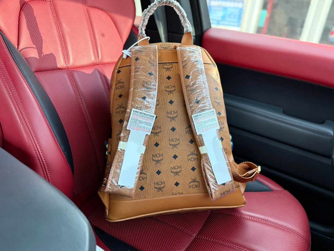 McM Stark Visetos Oversized Backpack | 2K Gold-Plated Rivets & Vintage Monogram Coated Canvas | Unisex Cognac Brown | 40CM Luxury Travel Bag