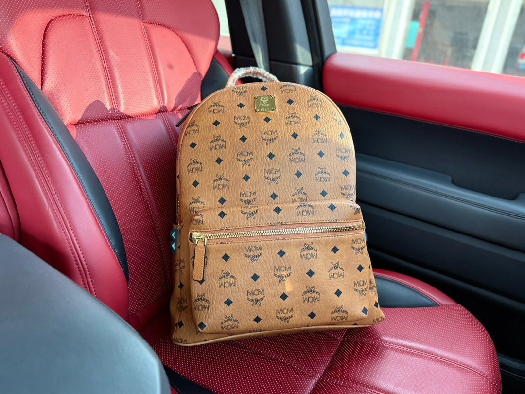 McM Stark Visetos Oversized Backpack | 2K Gold-Plated Rivets & Vintage Monogram Coated Canvas | Unisex Cognac Brown | 40CM Luxury Travel Bag