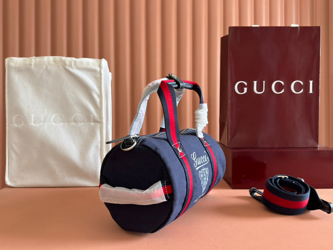 Gucci Spring Summer 2025 Men's Navy Canvas Travel Bag | Blue Leather Trim, Red-Green Web Strap, "Made in Italy" Emblem