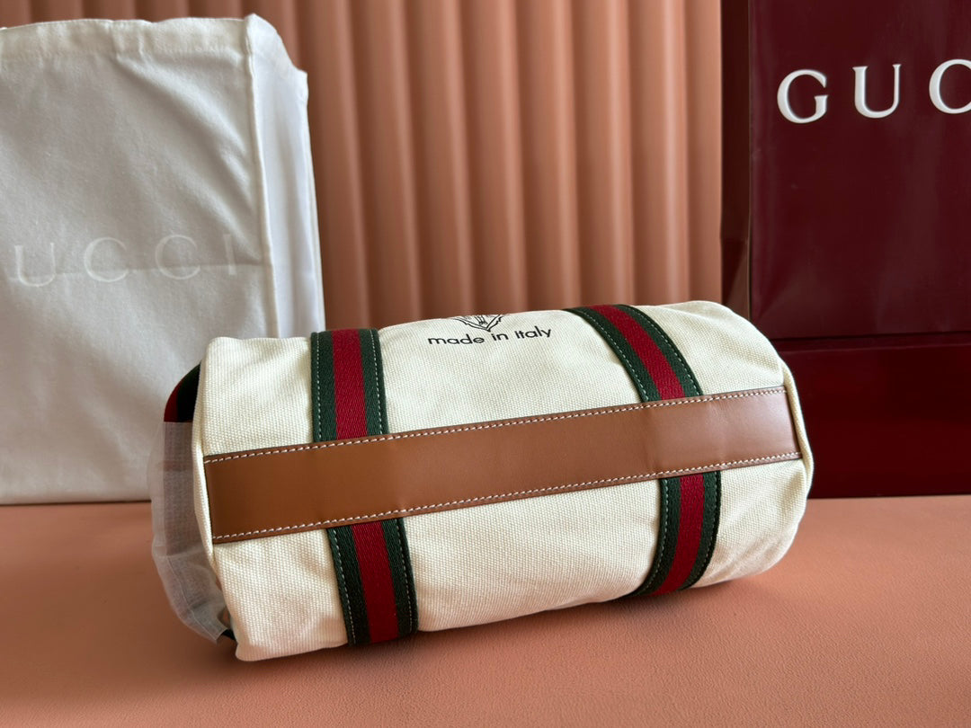 Gucci Spring Summer 2025 Men's Canvas Travel Bag | Navy Leather Trim Red-Green Web Strap Made in Italy Emblem