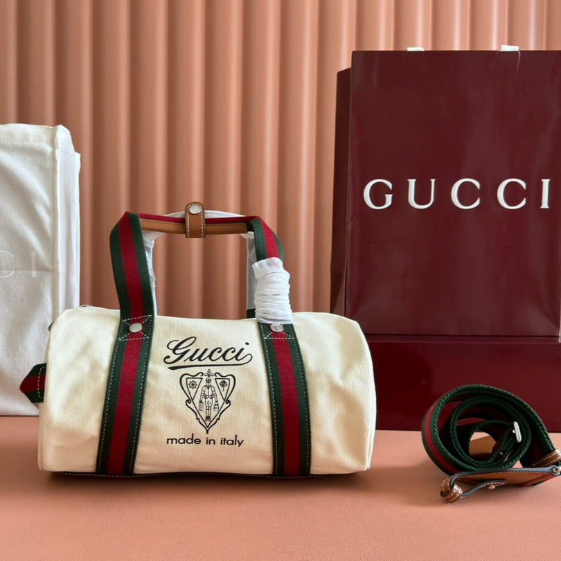 Gucci Spring Summer 2025 Men's Canvas Travel Bag | Navy Leather Trim Red-Green Web Strap Made in Italy Emblem