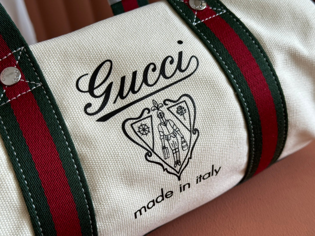 Gucci Spring Summer 2025 Men's Canvas Travel Bag | Navy Leather Trim Red-Green Web Strap Made in Italy Emblem