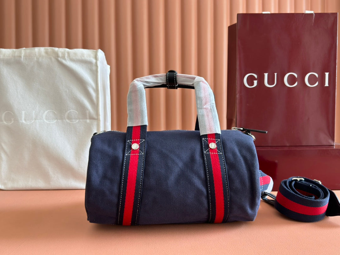 Gucci Spring Summer 2025 Men's Navy Canvas Travel Bag | Blue Leather Trim, Red-Green Web Strap, "Made in Italy" Emblem
